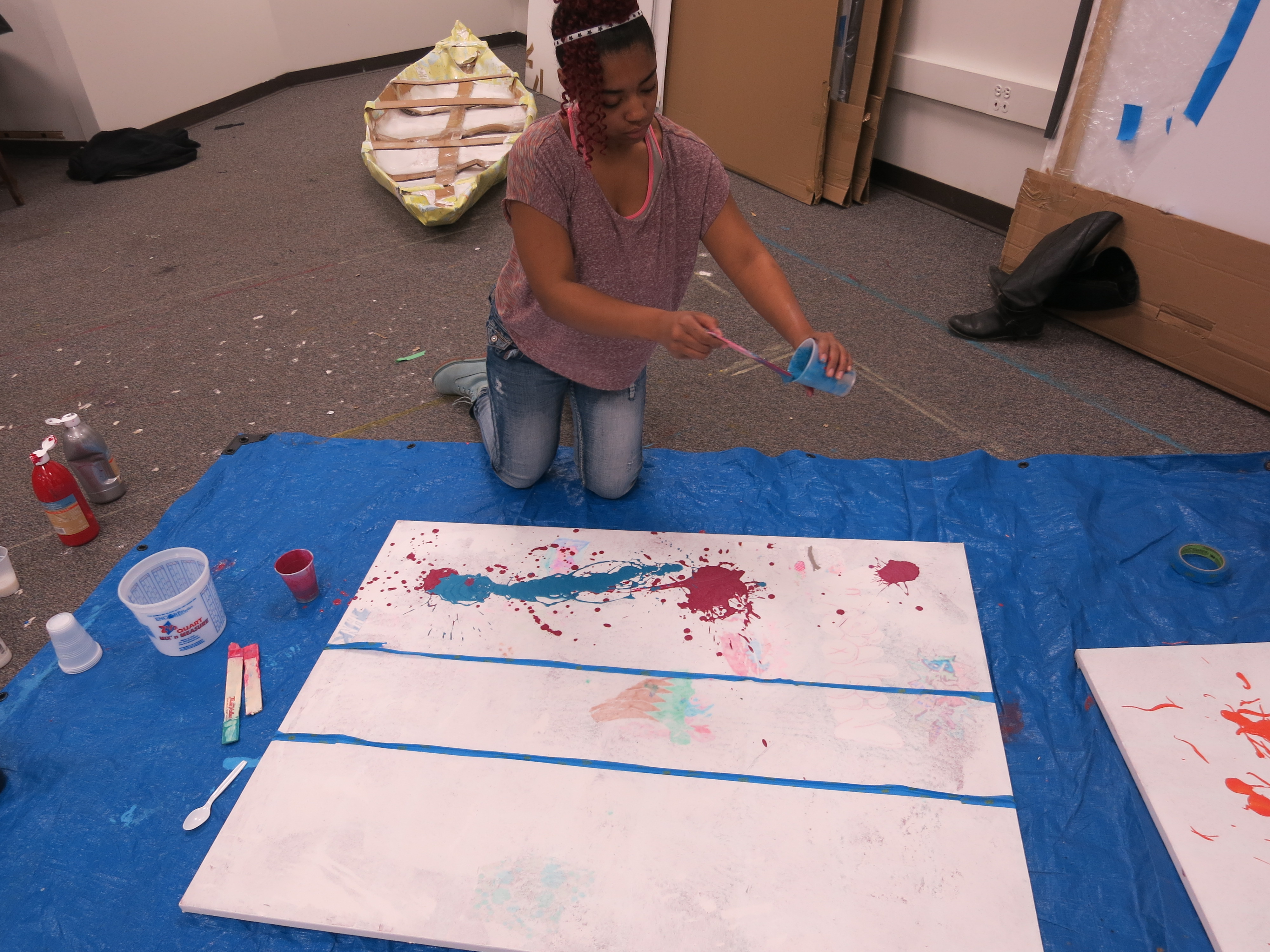 picture of teens creating drip paintings during Air It Out semester of art