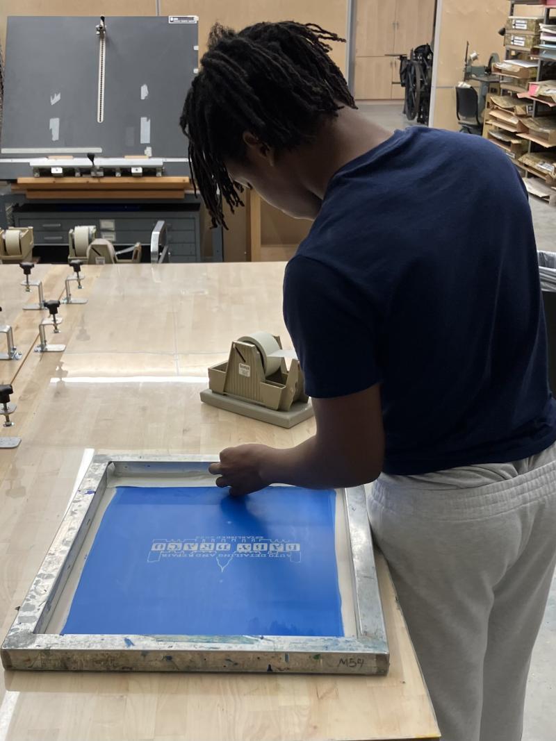 Prepping a silk screen at Madison College